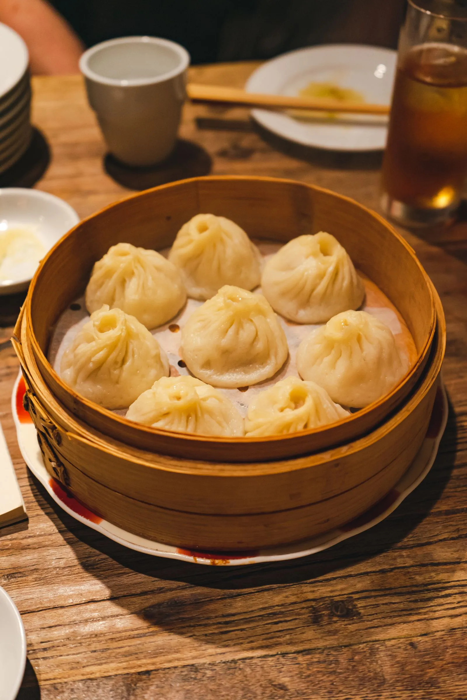 Xiaolongbao soup dumplings in a bamboo steamer