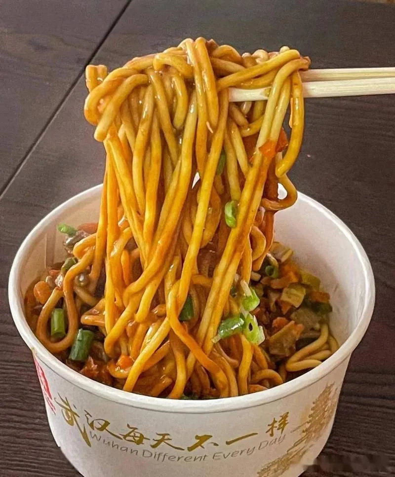 A bowl of Wuhan hot dry noodles (reganmian) coated in sesame paste