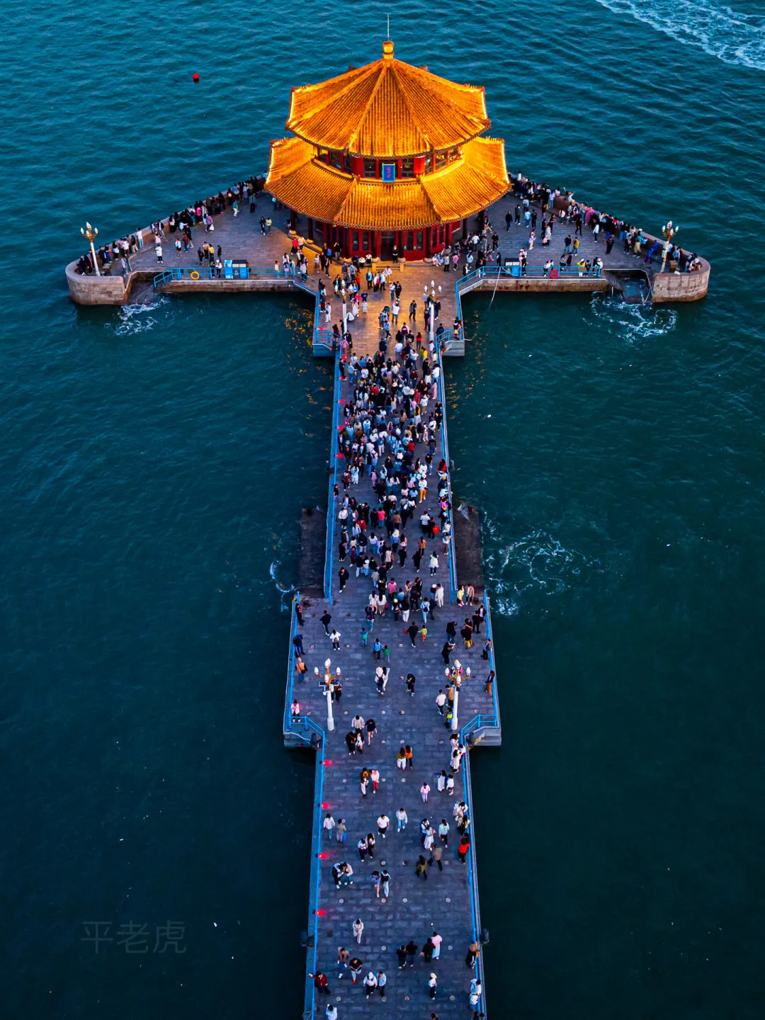 Zhanqiao Pier and Huilan Pavilion lit up at night, Qingdao's 1892 waterfront emblem
