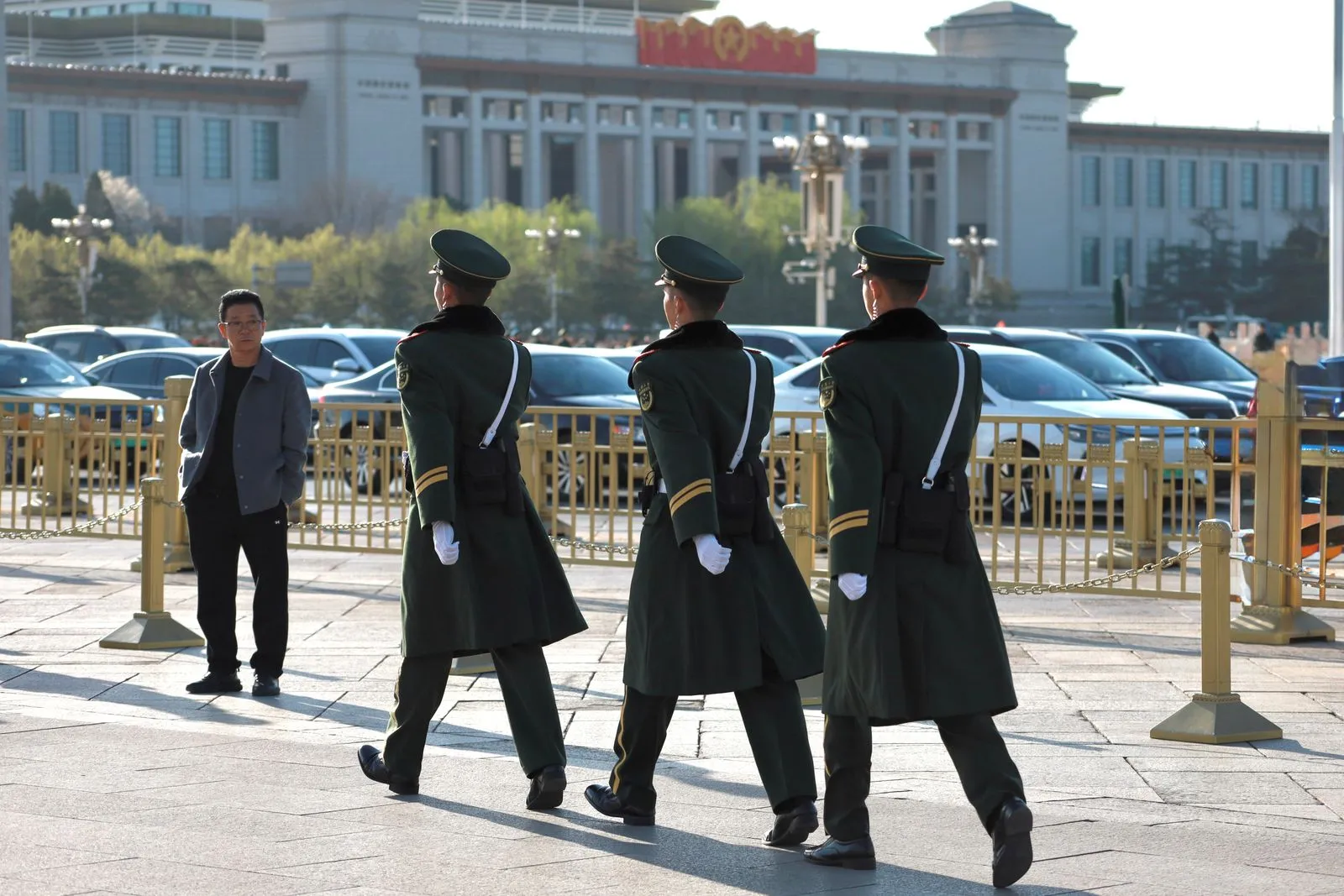 Uniformed guards outside a Beijing state building