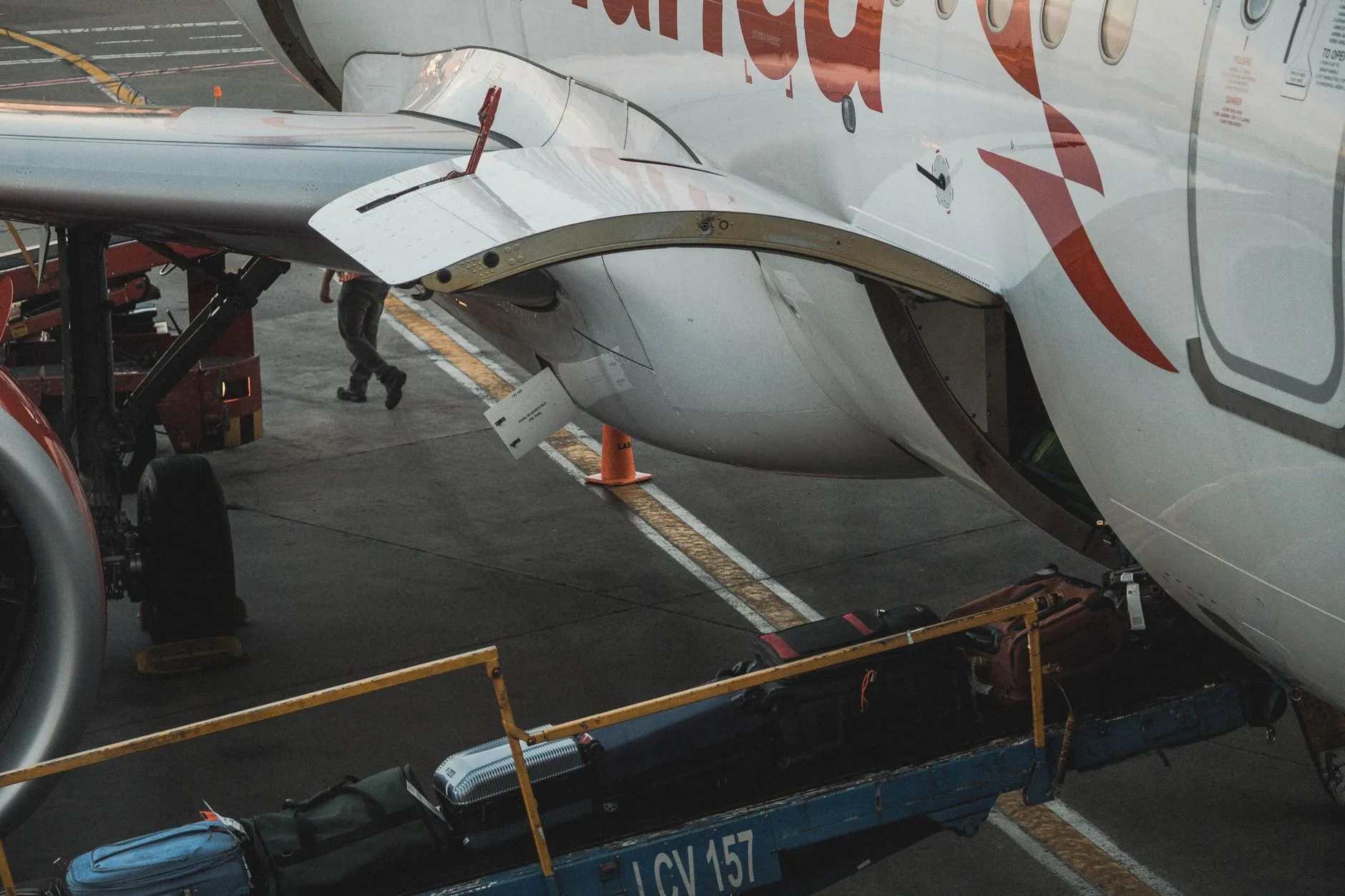 Suitcases being loaded into an aircraft cargo hold