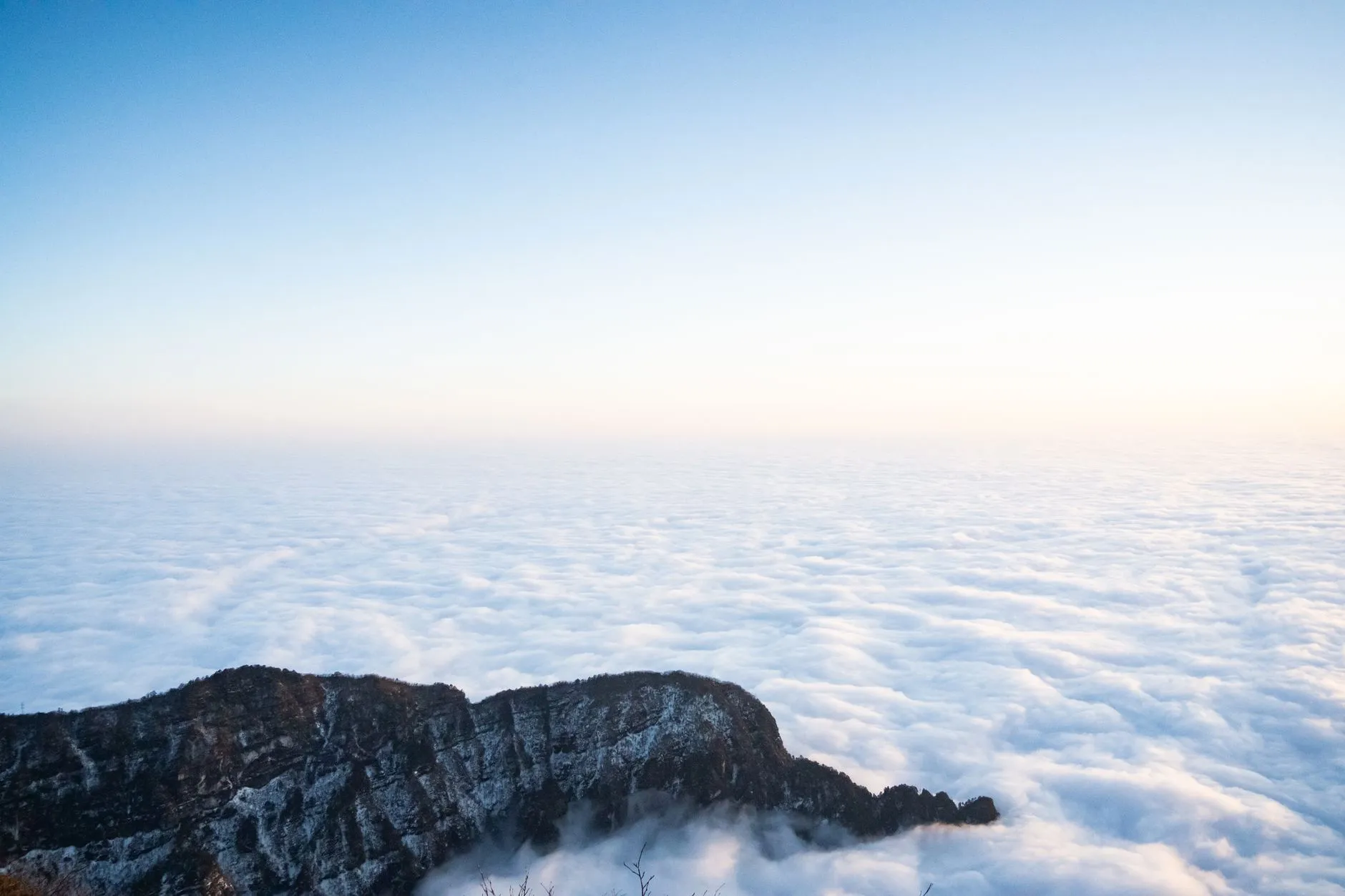 Emei's forested peaks and sea of clouds seen from the Golden Summit ridge