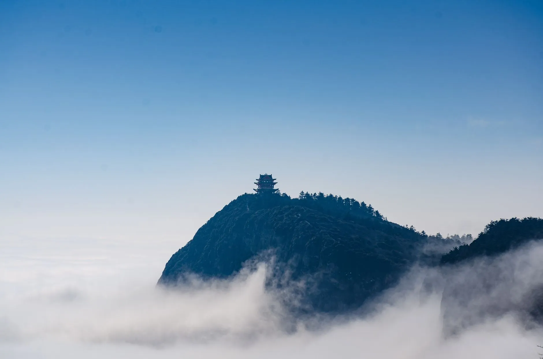 The gilded ten-direction Puxian pavilion at Emei's Golden Summit above the clouds
