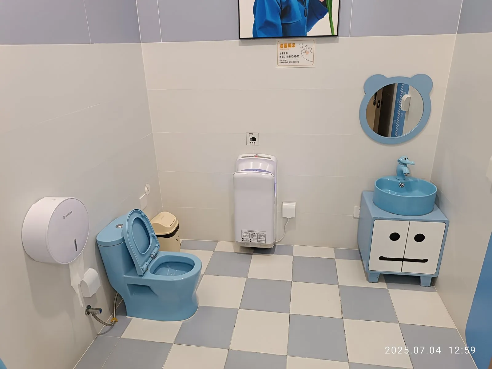 Inside a child-friendly family restroom with a child-height toilet and washbasin in a shopping mall in Futian, Shenzhen