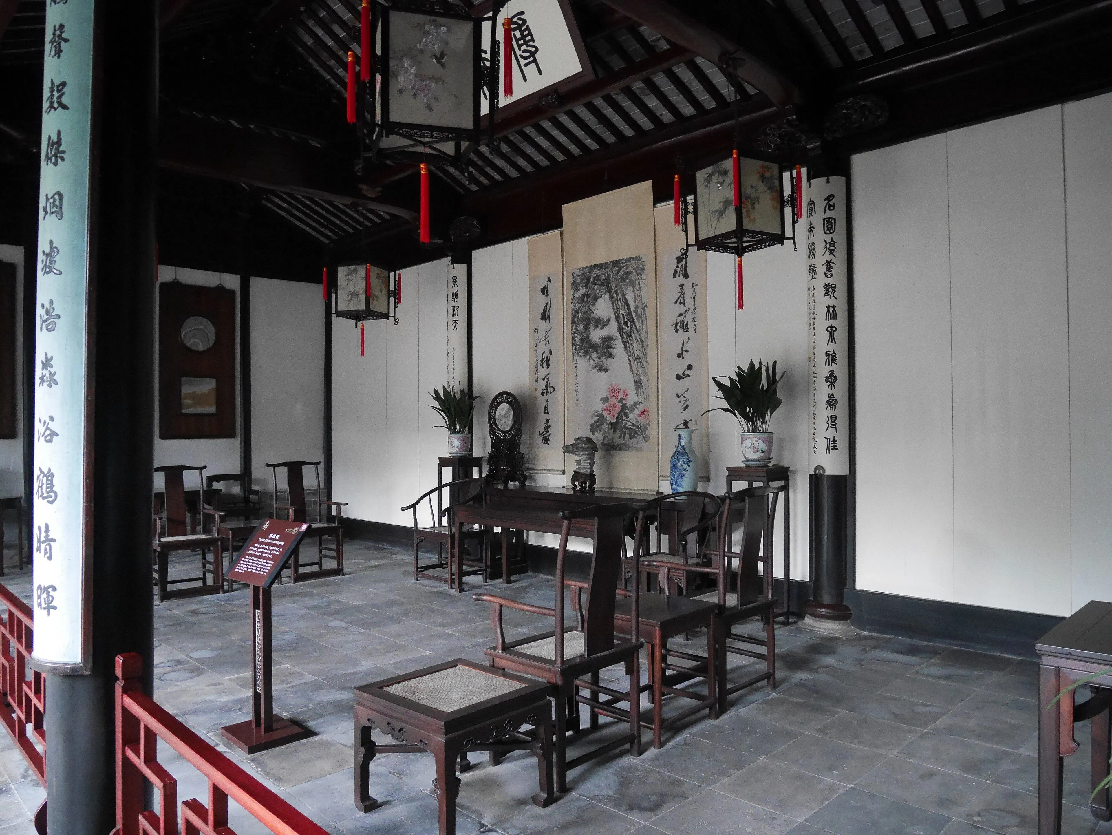 The Boya Tang hall in the Garden of Cultivation, furnished with Ming-style chairs, calligraphy panels and red-tasselled lanterns
