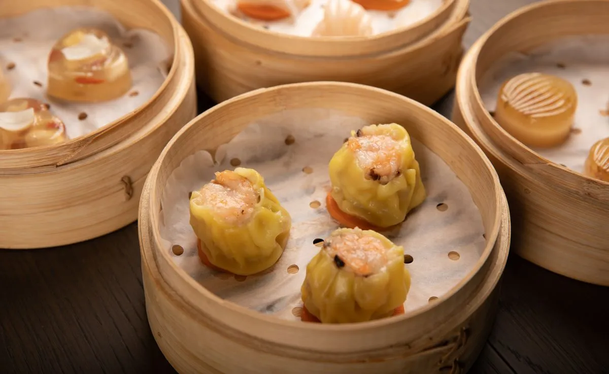 Assorted dim sum in bamboo steamers — traditional Chinese cuisine