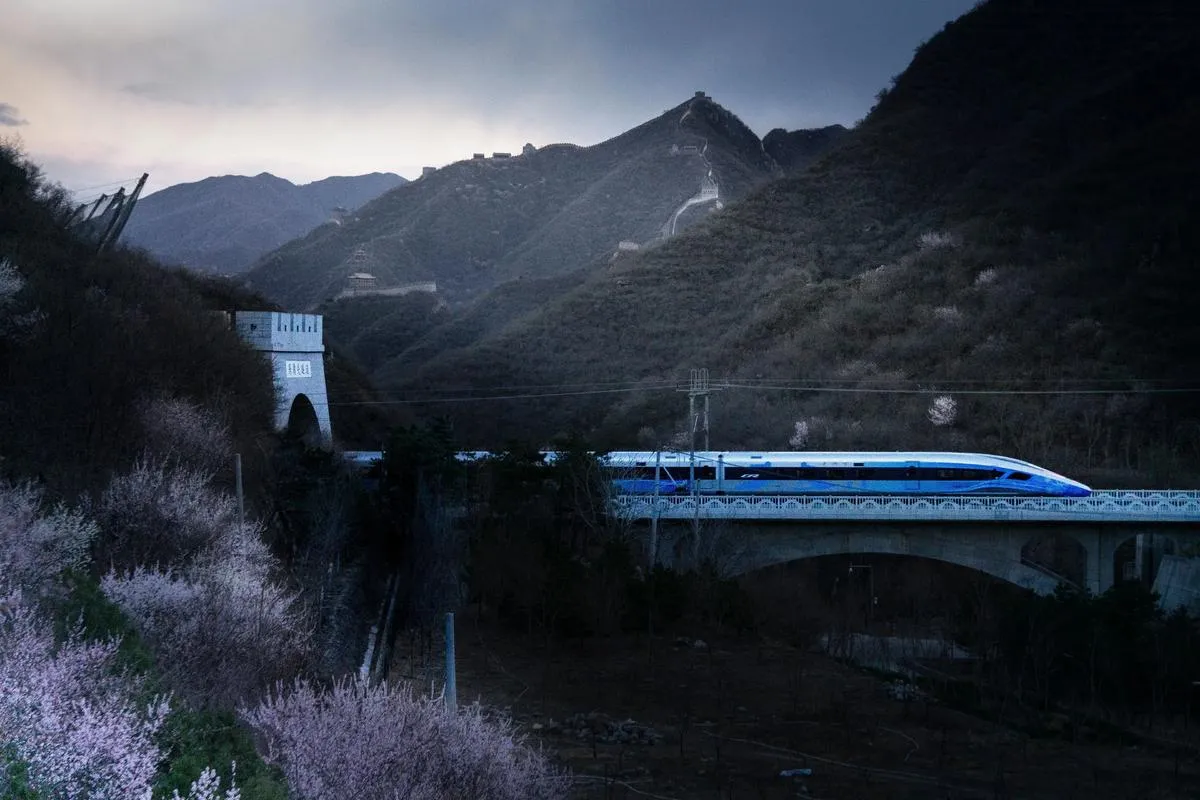 Fuxing high-speed train passing the Great Wall